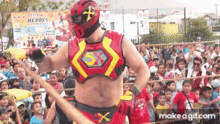 a man in a red and yellow superhero costume with the letter x on his chest