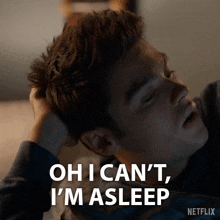 a man is laying on a bed and says oh i can t i 'm asleep