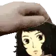 a hand is holding a girl 's head with a hat on it .