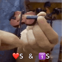 a person is holding a violin with the letters s & i visible