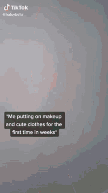 a tiktok video of a woman putting on makeup