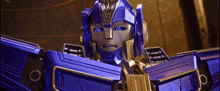 a close up of a purple and gold transformer