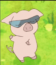 a pig wearing sunglasses is standing in the grass .