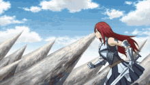 a woman with red hair is holding a sword in her hand