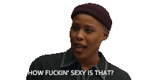 a woman wearing a beanie is asking how fuckin sexy is that