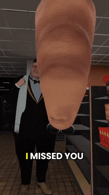 a man in a tuxedo is standing in front of a shelf that says ' i missed you ' on it