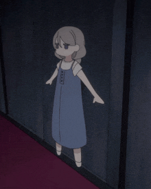 a little girl in a blue dress is standing in a dark room