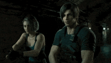 a man and a woman are standing next to each other in a dark tunnel holding guns .