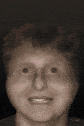 a close up of a person 's face with a blurred background and a few numbers on it