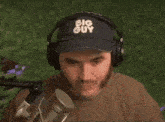 a man wearing a hat that says big guy