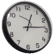 a black and white wall clock shows the time as 4:20