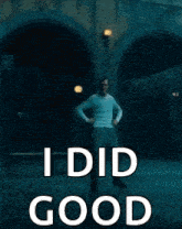a man is dancing in a dark room with the words `` i did good '' written on the bottom .