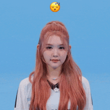 a girl with pink hair is making a funny face