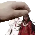a hand is holding a picture of a woman in a red dress