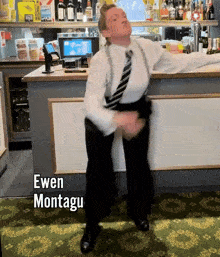 a man is dancing in front of a bar with the name ewen montagu on the bottom right