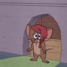 jerry is wearing a red hat and standing in a doorway .