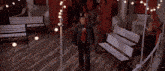 a group of people are standing in a room with a sign that says life