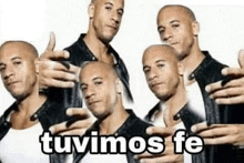 a group of bald men are standing next to each other holding their hands up and giving a thumbs up .
