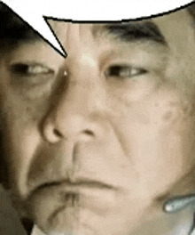 a man wearing a headset with a speech bubble above his head .