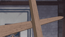 a drawing of a wooden cross with the words ndos sama on the bottom right