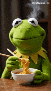 kermit the frog eating noodles with chopsticks from a bowl