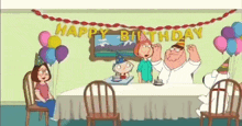 a family guy birthday party with a cake and balloons