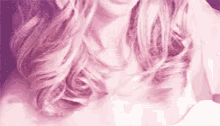a close up of a woman 's hair in a pink and purple tone .