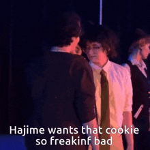 a group of people standing next to each other with the words hajime wants that cookie so freakin ' bad below them