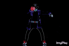 a group of people are dancing in a dark room with the words imgplay in the bottom right corner