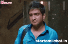 a man in a blue shirt with the words starttamilchat.in on the bottom right