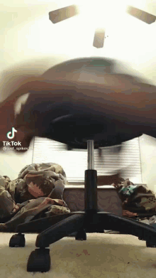 a tiktok video of a person sitting on an office chair