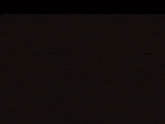 a large circle of fire is surrounding a black background