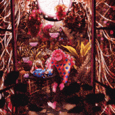 a painting of a person sitting at a table in a garden