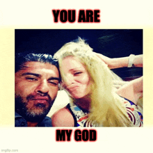 a man and a woman are posing for a picture with the caption you are my god