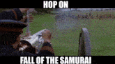 a man is holding a cannon in a field with the words hop on fall of the samurai on the bottom