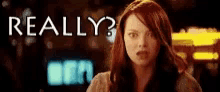 a woman is standing in front of a sign that says really ?