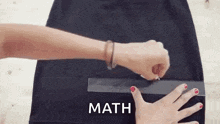 a woman is cutting a piece of fabric with a ruler and the word math is above her .