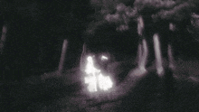 two ghosts are standing in the dark holding hands