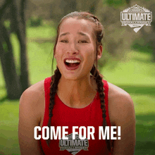 a woman wearing a red tank top that says come for me on it