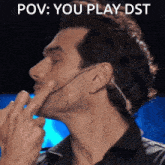 a man with a microphone in his ear says " pov : you play dst " on the bottom