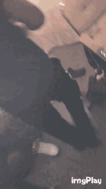 a gif of a person sitting on a chair with the words imgplay below it