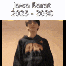 a man wearing a black hoodie with the words jawa barat 2025-2030 written on it