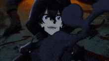 a person 's shadow is cast on the ground in a dark room