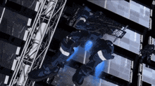 a robot is flying through a building with a blue light coming out of it