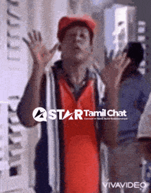 a man in a red shirt with the words star tamil chat on the bottom