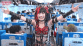 a woman in a gothic outfit is standing on a plane