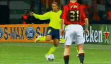 a soccer player with the number 31 on his jersey is kicking a soccer ball
