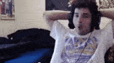 a man wearing headphones and a lakers t-shirt