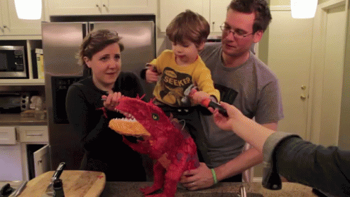 Kid Beats Up Dinosaur! GIF - Dinosaur Pinata Hammer GIFs