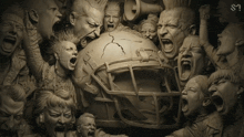 a statue of a football helmet is surrounded by a crowd of people with their mouths open